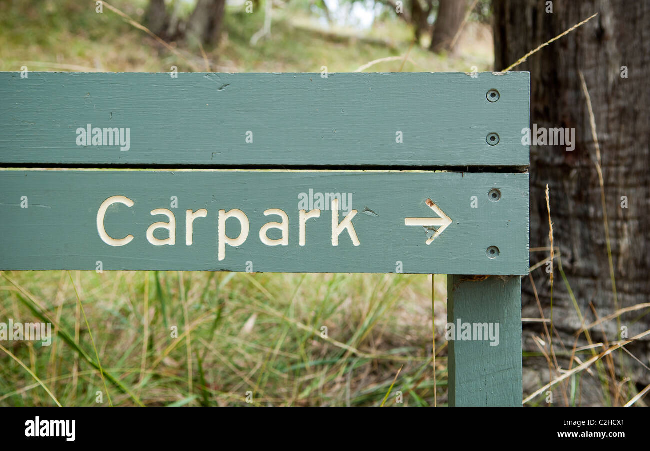 Wooden boards direct you toward the carpark Stock Photo