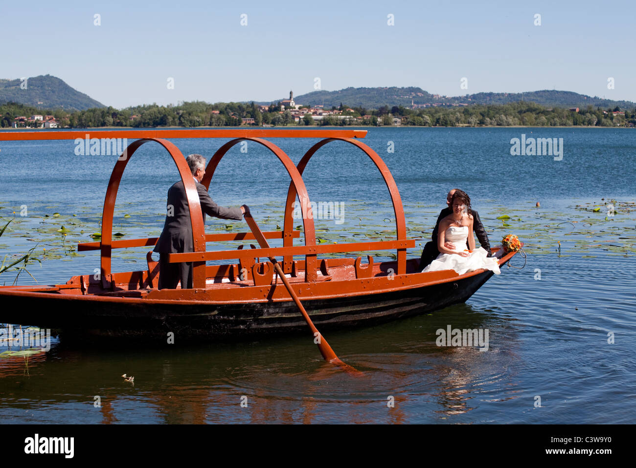 Just married couple having a tour on an old fashioned boat on the lake Pusiano, Erba, Como Stock Photo