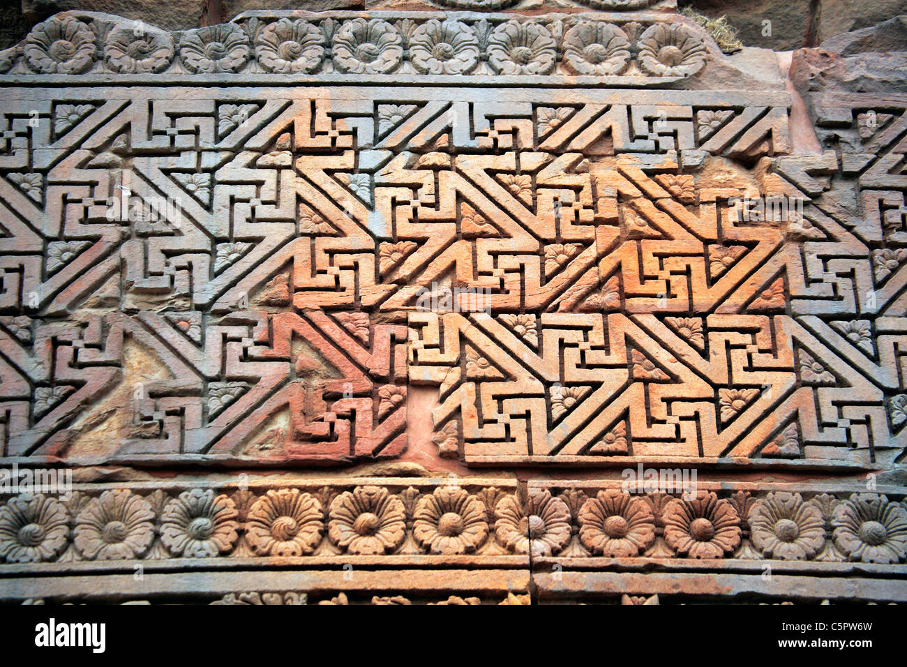 Stone carved wall of temple, Sarnath, Uttar Pradesh, India Stock Photo