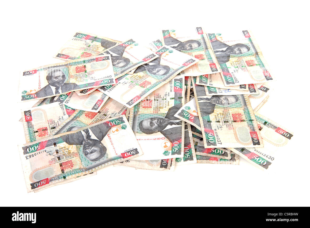 Pile of Kenyan currency over white background Stock Photo