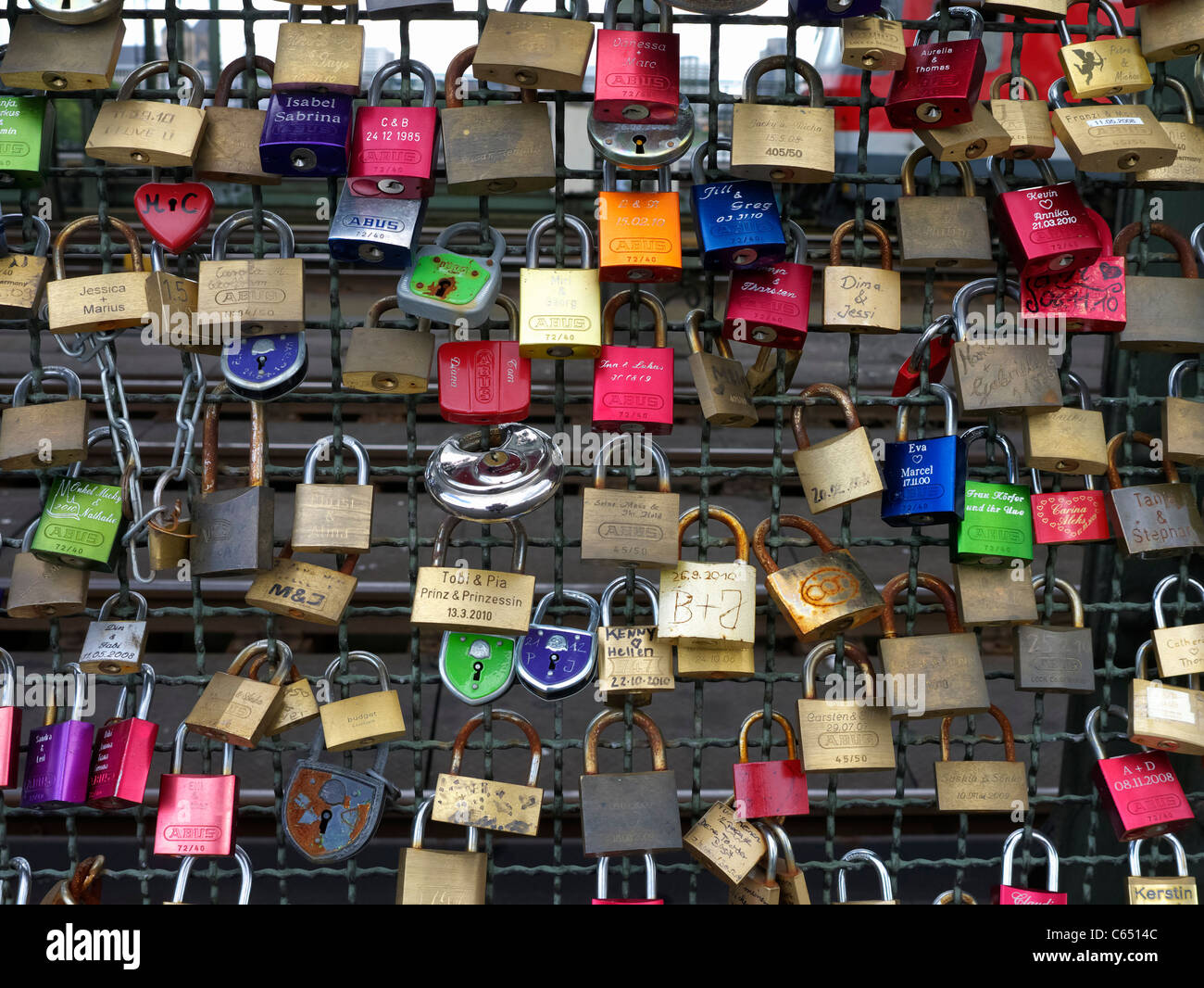 Detail of locks attached to Hohenzollern Bridge by lovers in Cologne Germany Stock Photo