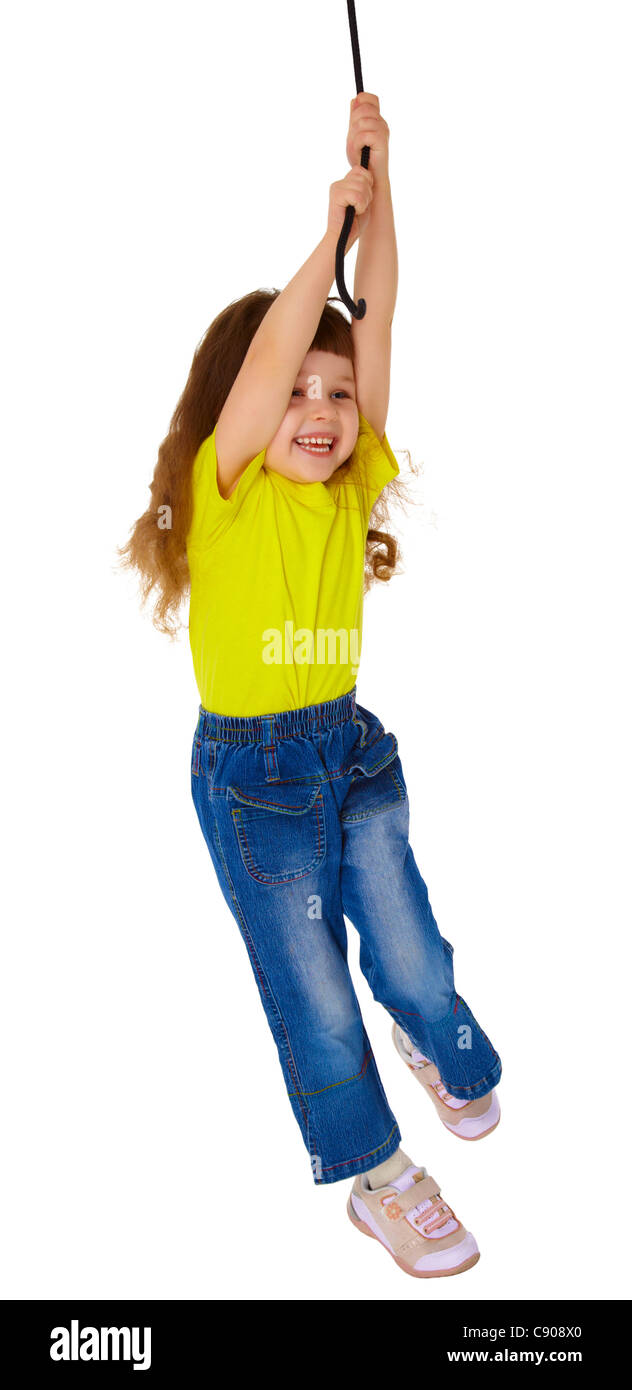 Little girl swinging on a rope isolated on white background Stock Photo