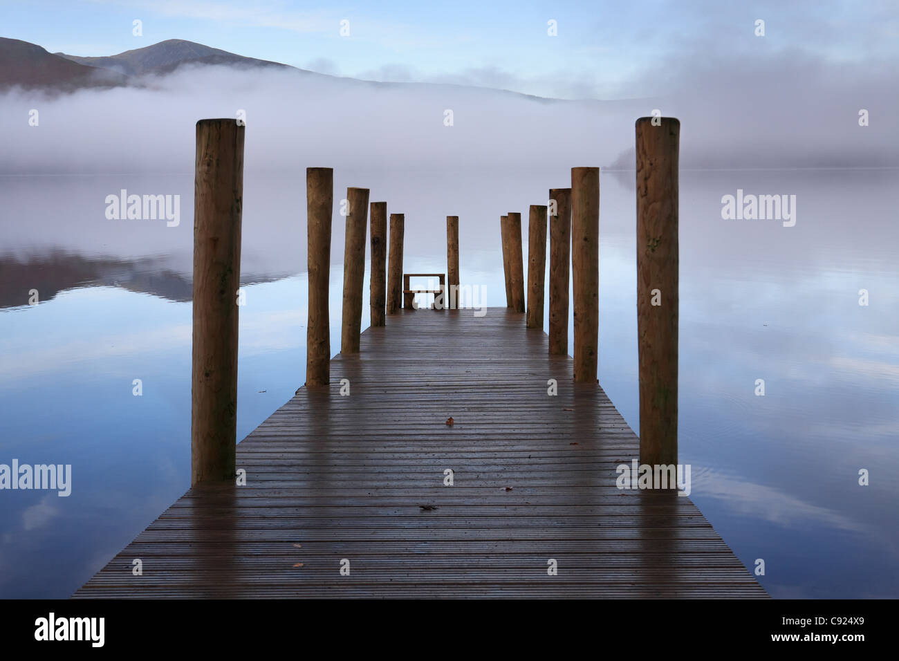 Mist over Derwentwater with a wooden Jetty, near Keswick, north west England, UK Stock Photo