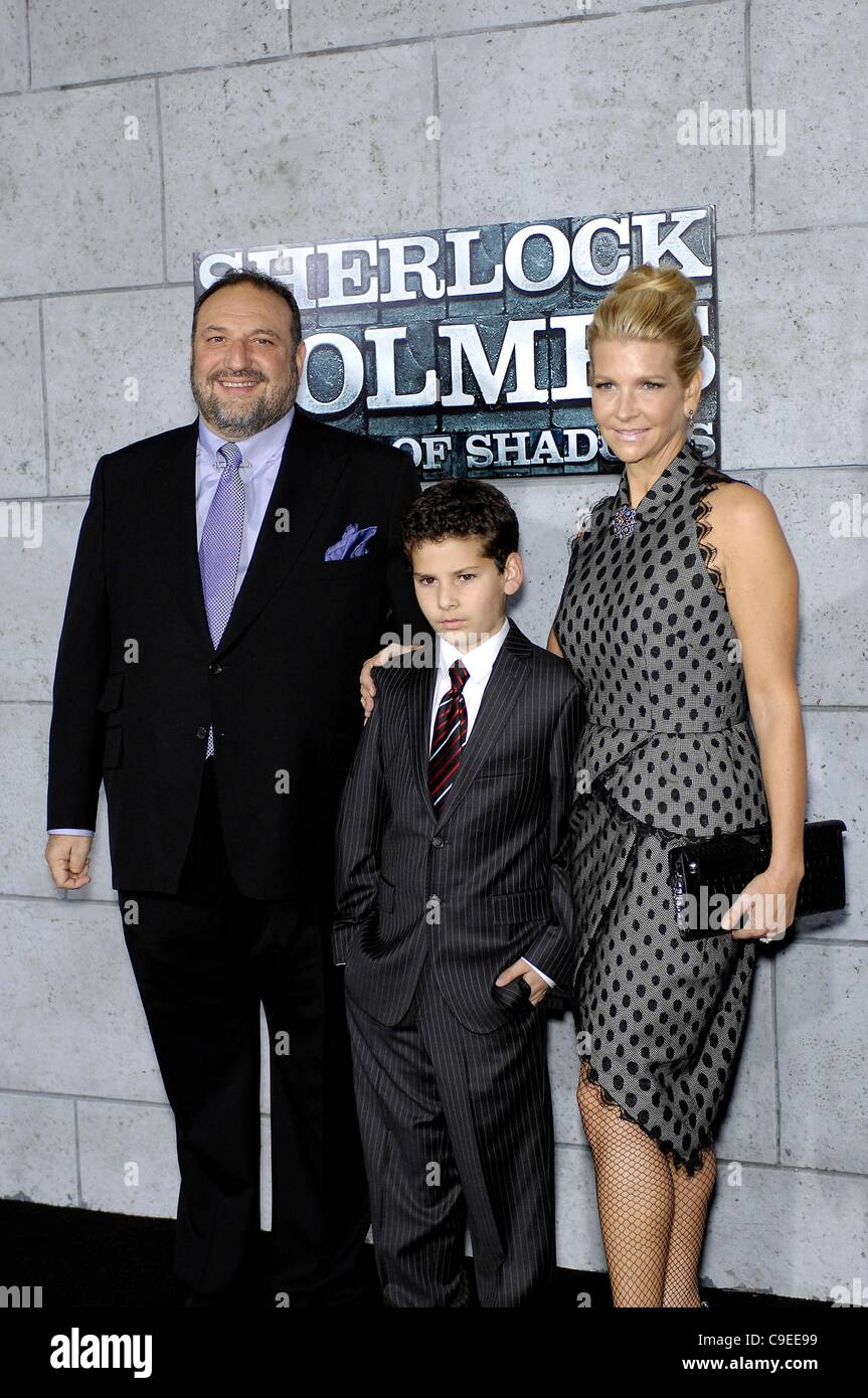 Joel Silver, Max Silver, Karen Silver at arrivals for Sherlock Holmes: A Game of Shadows Premiere, Village Theatre in Westwood, Los Angeles, CA December 6, 2011. Photo By: Michael Germana/Everett Collection Stock Photo