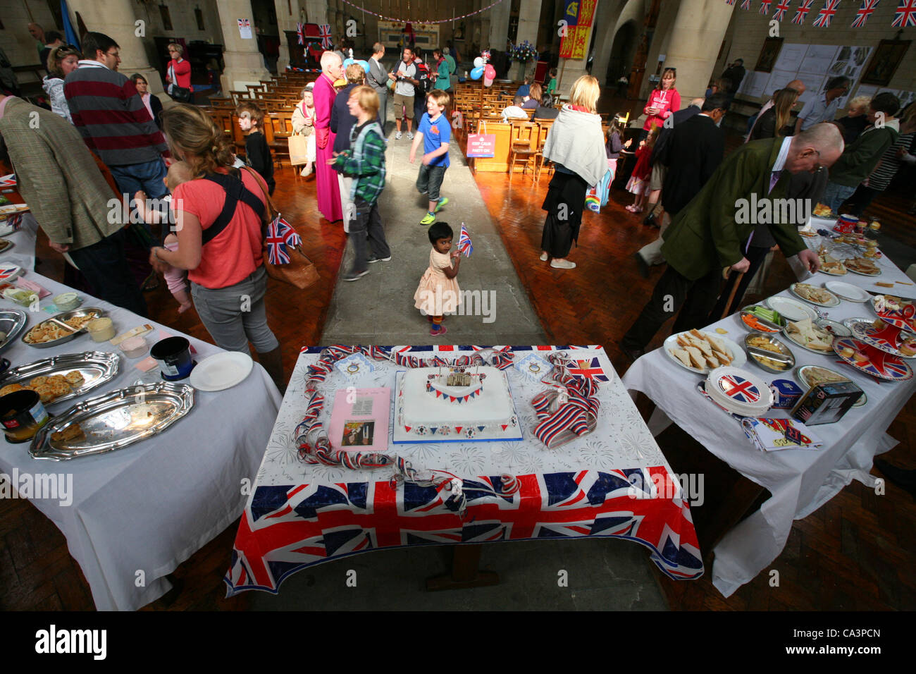 London, United Kingdom, 02/06/2012. People in Gospel Oak gathered in  the All Hallows Church, Savernake Road to hold an indoor Jubilee street party. Stock Photo