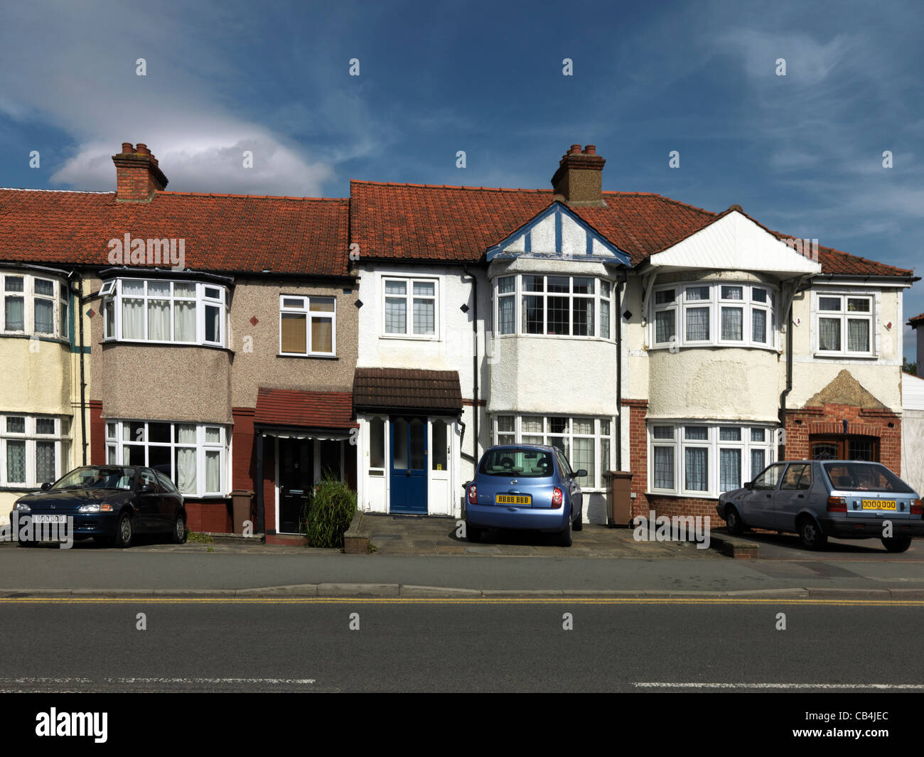 A Row Of terraced Houses With Gardens Paved Over England Stock Photo