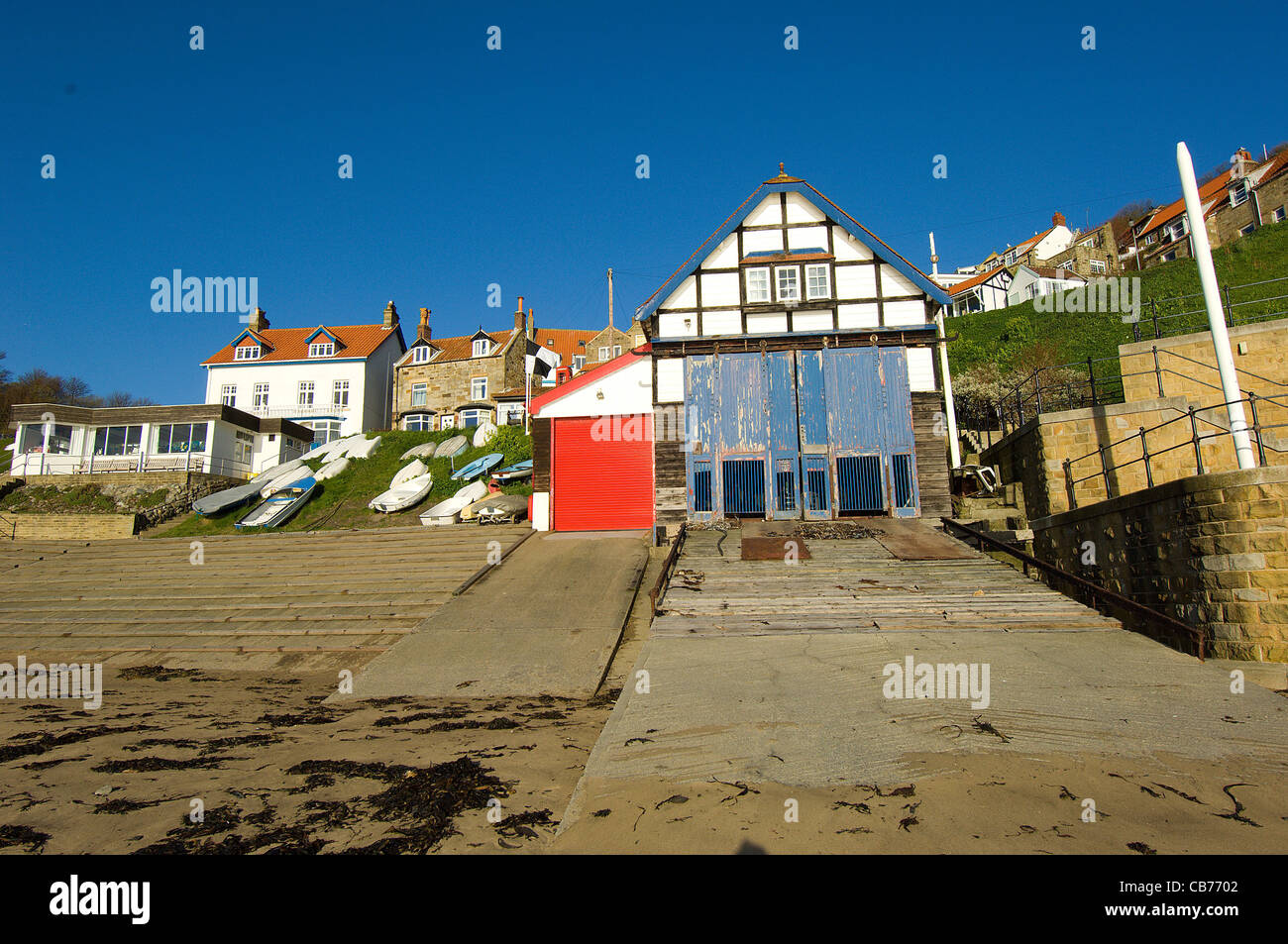 Runswick Bay in North Yorkshire, England, is a picturesque fishing village with a slip-way and old-fashioned boat-shed. Stock Photo