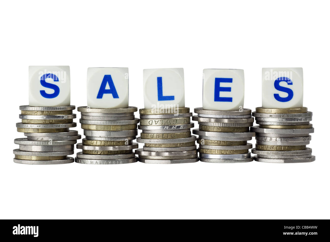 Stacks of coins with the word SALES isolated on white background Stock Photo