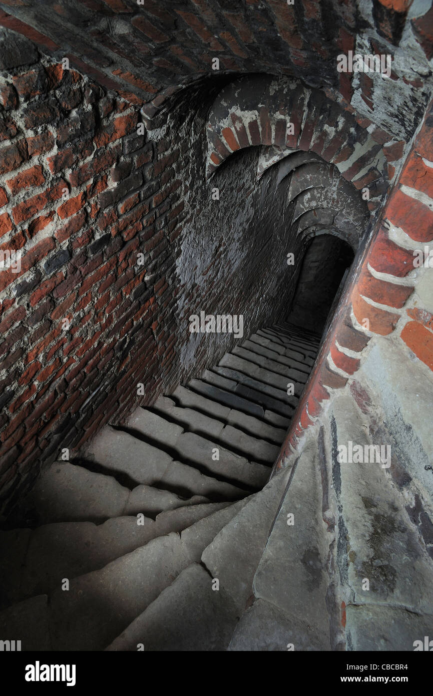 Narrow stone staircase with arched ceiling in the medieval Beersel Castle, Belgium Stock Photo