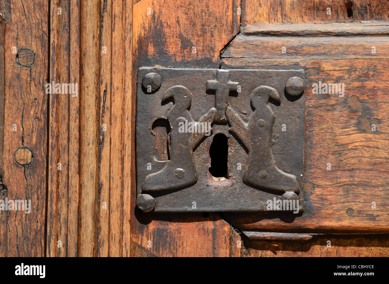 Old Lock with Christian Penitents, Door of Chapel of the White Penitents (1492),  La Tour or La Tour-sur-Tinée, Alpes-Maritimes Stock Photo