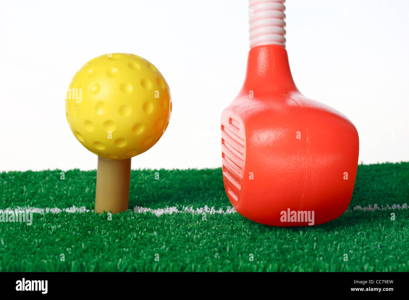 Golf equipment for kids. Golf toys. Ball, driver, clubs, iron, woods, bag, tee, green. Stock Photo