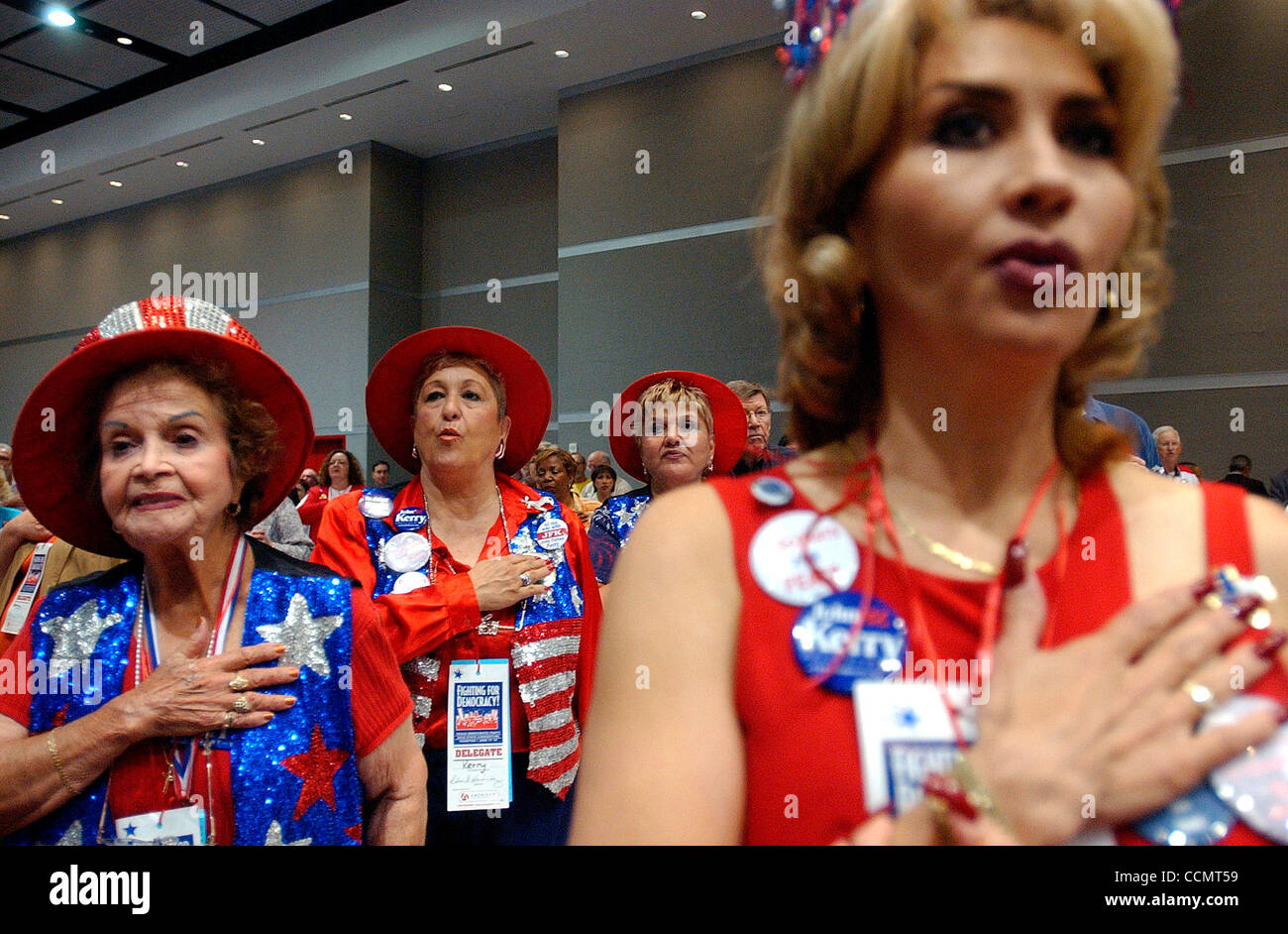 Jun 19, 2004; Houston, TX, USA; El Paso Tejano Democrats, from (L-R) SOLEDAD A. GALVAN, ELVIA HERNANDEZ, YOLANDA ESPARZA, and NORMA GARCIA pledge allegiance to the flag during the Blue Star Breakfast to celebrate Juneteenth at the Texas Democratic Party 2004 State Convention in Houston on Saturday,  Stock Photo