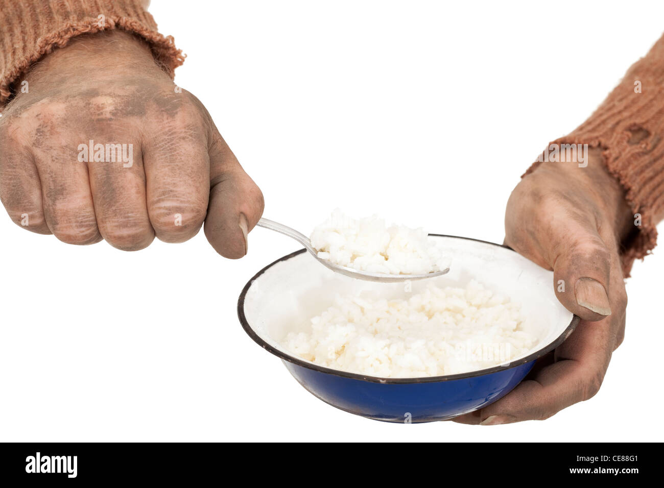 poor man in old sweater with bowl rice Stock Photo