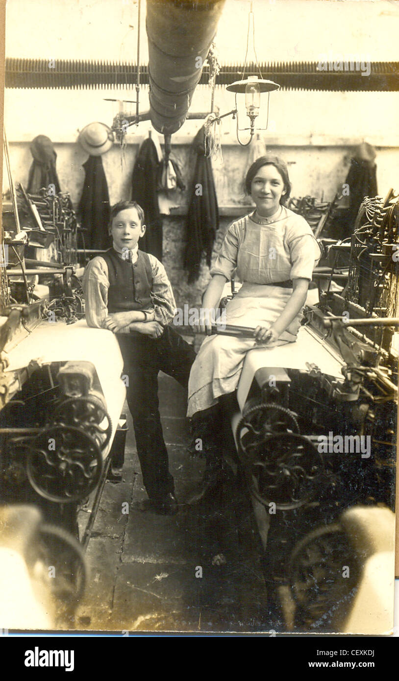 Postcard of the interior in a Lancashire cotton mill. Stock Photo