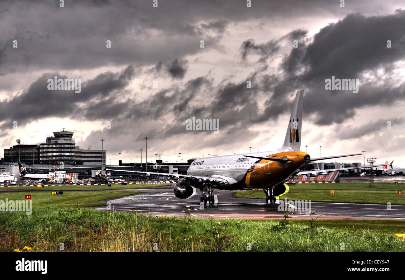 Monarch Aircraft taxi-ing into Manchester terminal 2 , Lancashire, UK Stock Photo