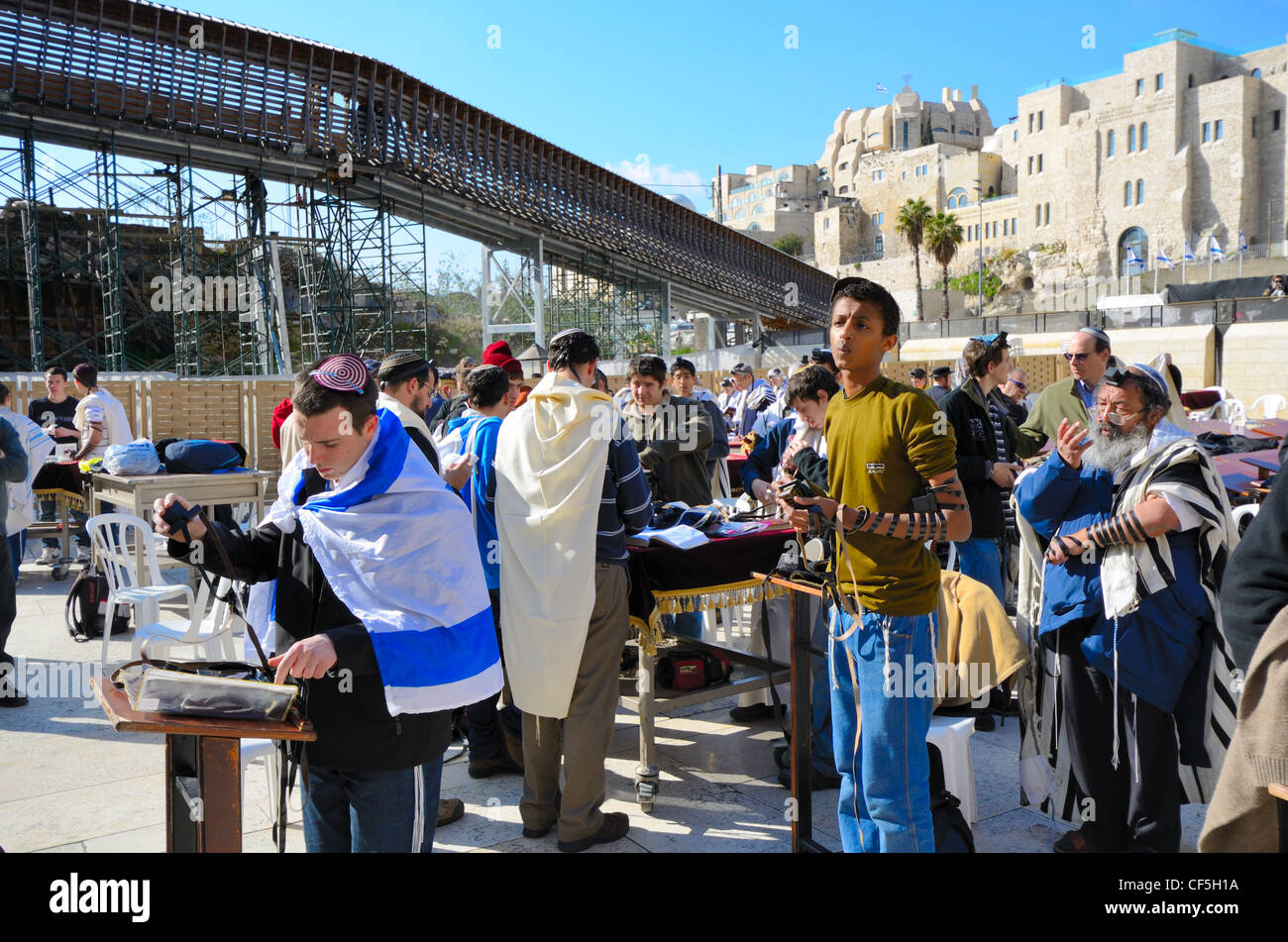 Crowds worship at the Western Wall, the holiest site in Judaism outside the Temple Mount itself in Jerusalem, Israel. Stock Photo