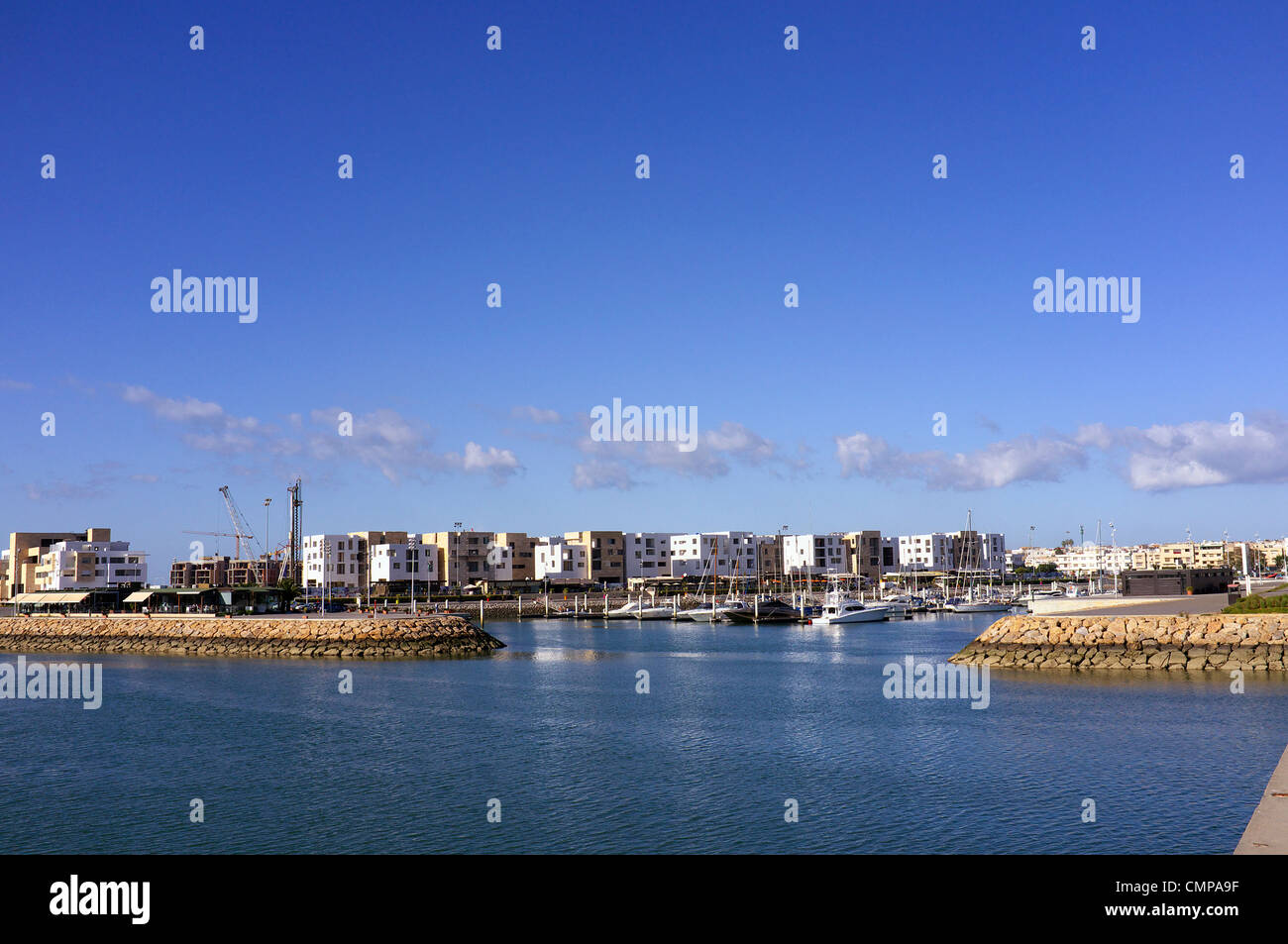 Looking into Marina Bouregreg situated in Salé on river Bou Regreg, north west Morocco also showing new build in progress Stock Photo