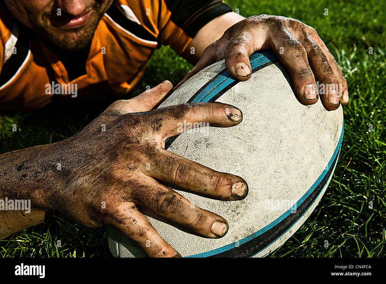 Rugby player scoring on pitch Stock Photo