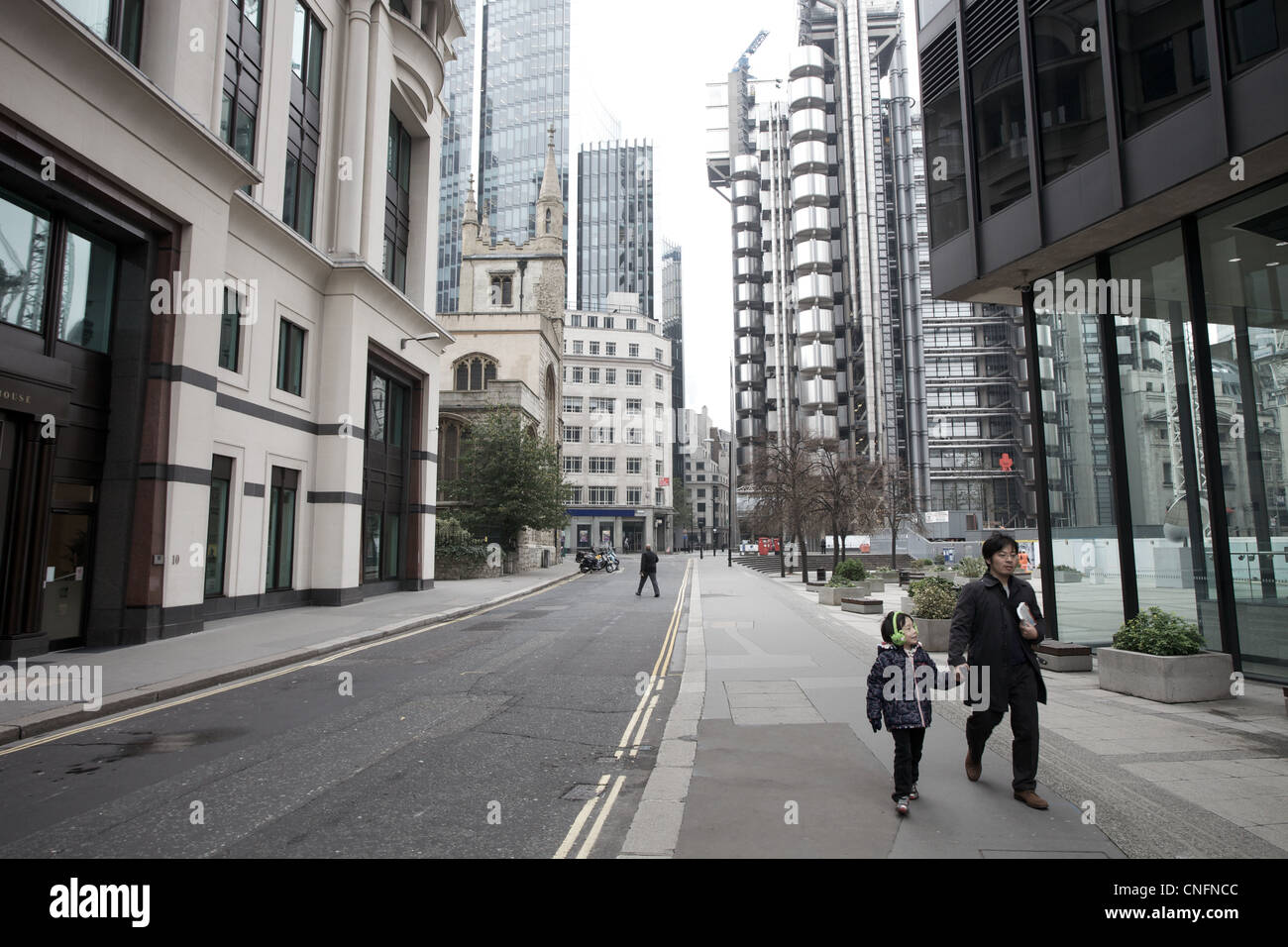 Street view of city of London, with Lloyds building in background. Stock Photo