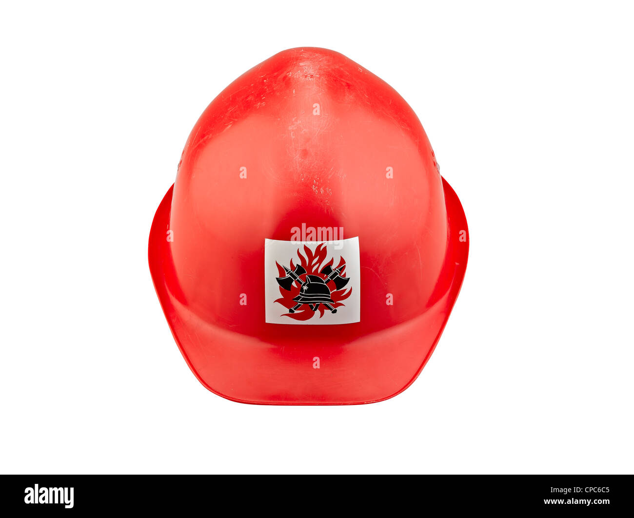 Old red plastic safety fireman helmet on white background (clipping path) Stock Photo