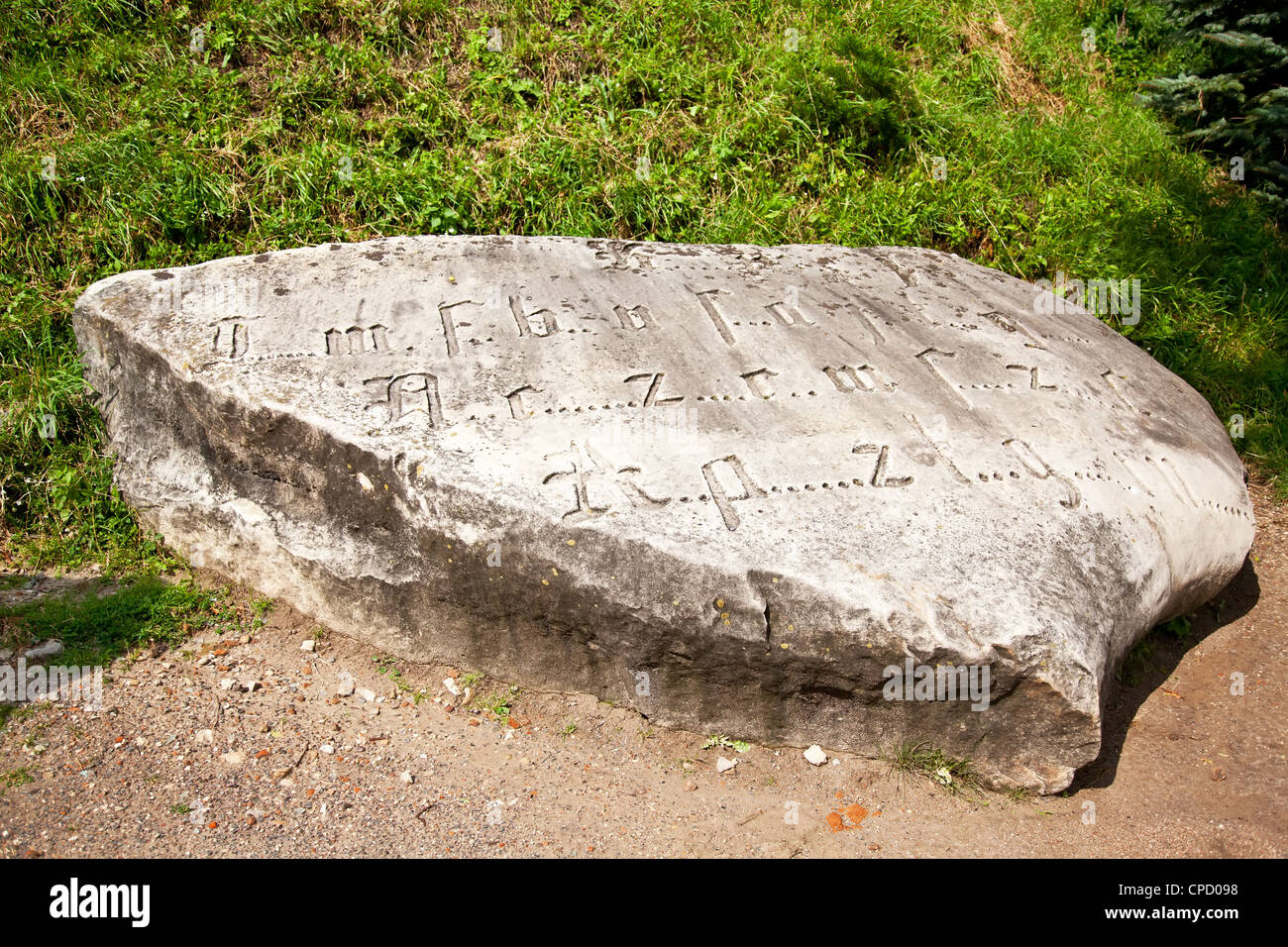 Medieval stone with letters Stock Photo