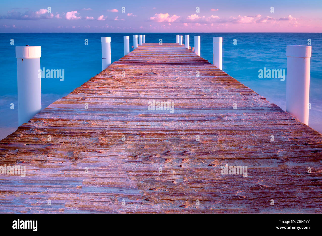 Pier at sunrise in Grace Bay. Providenciales. Turks and Caicos. Stock Photo