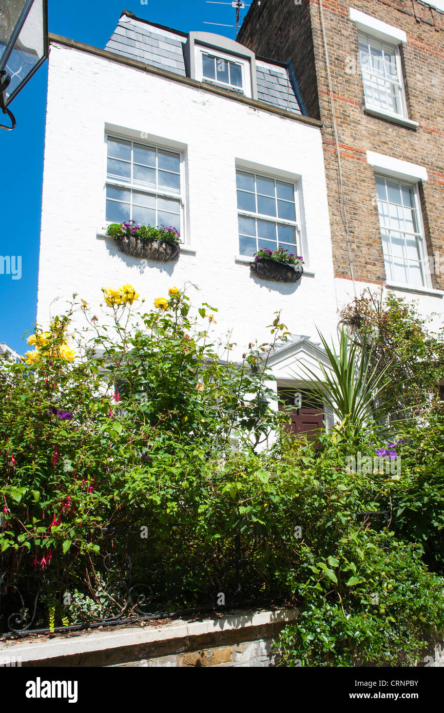 London Hampstead Village Flask Walk Georgian terraced houses or cottages with sash windows & colourful colorful doors garden Stock Photo