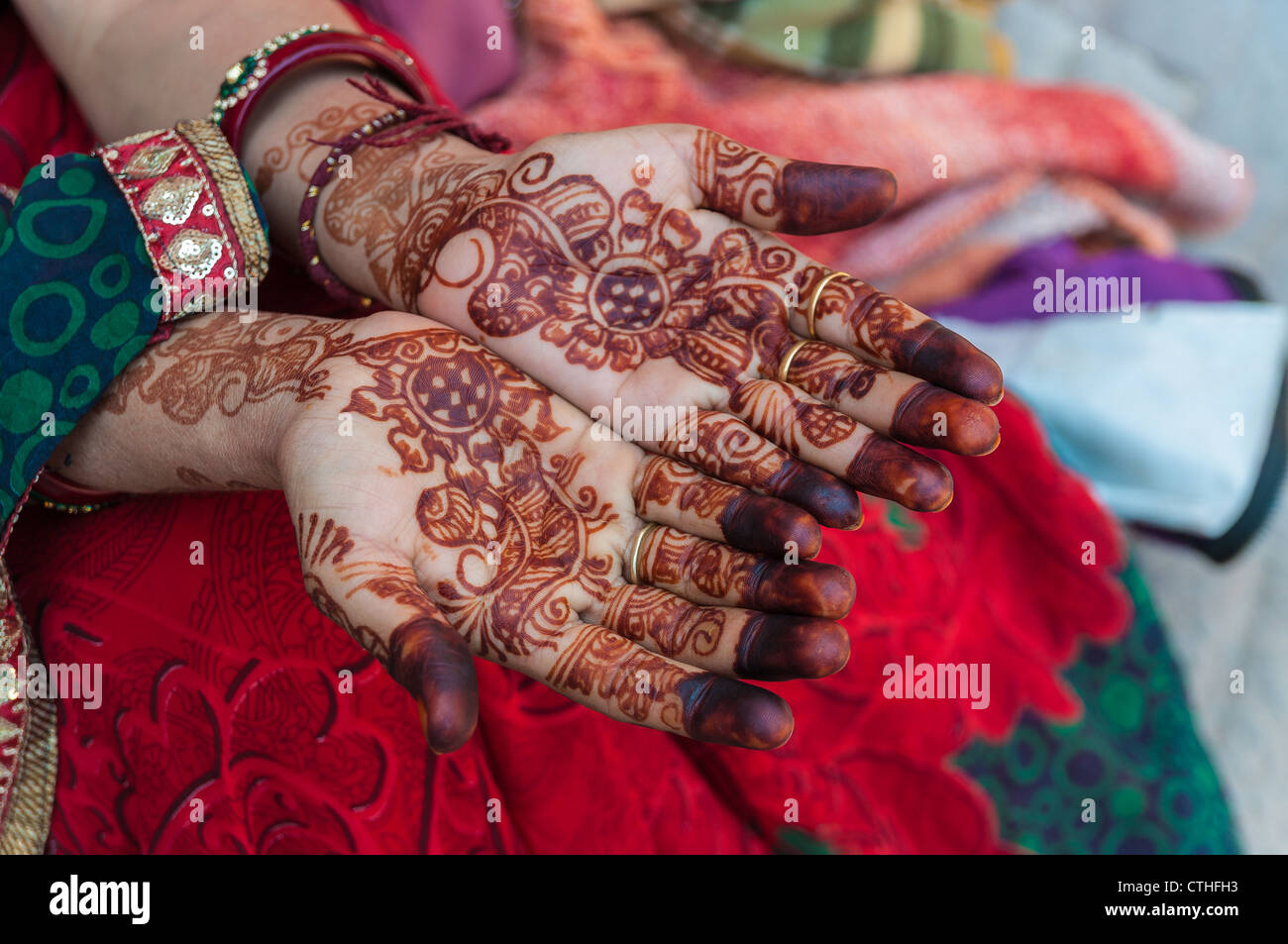 An Indian woman with henna tattoos on the hands, India Stock Photo