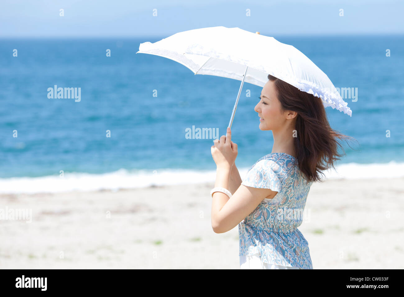 Woman with parasol Stock Photo