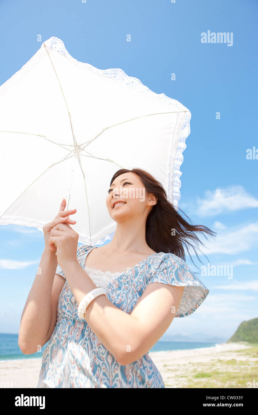 Woman with parasol Stock Photo