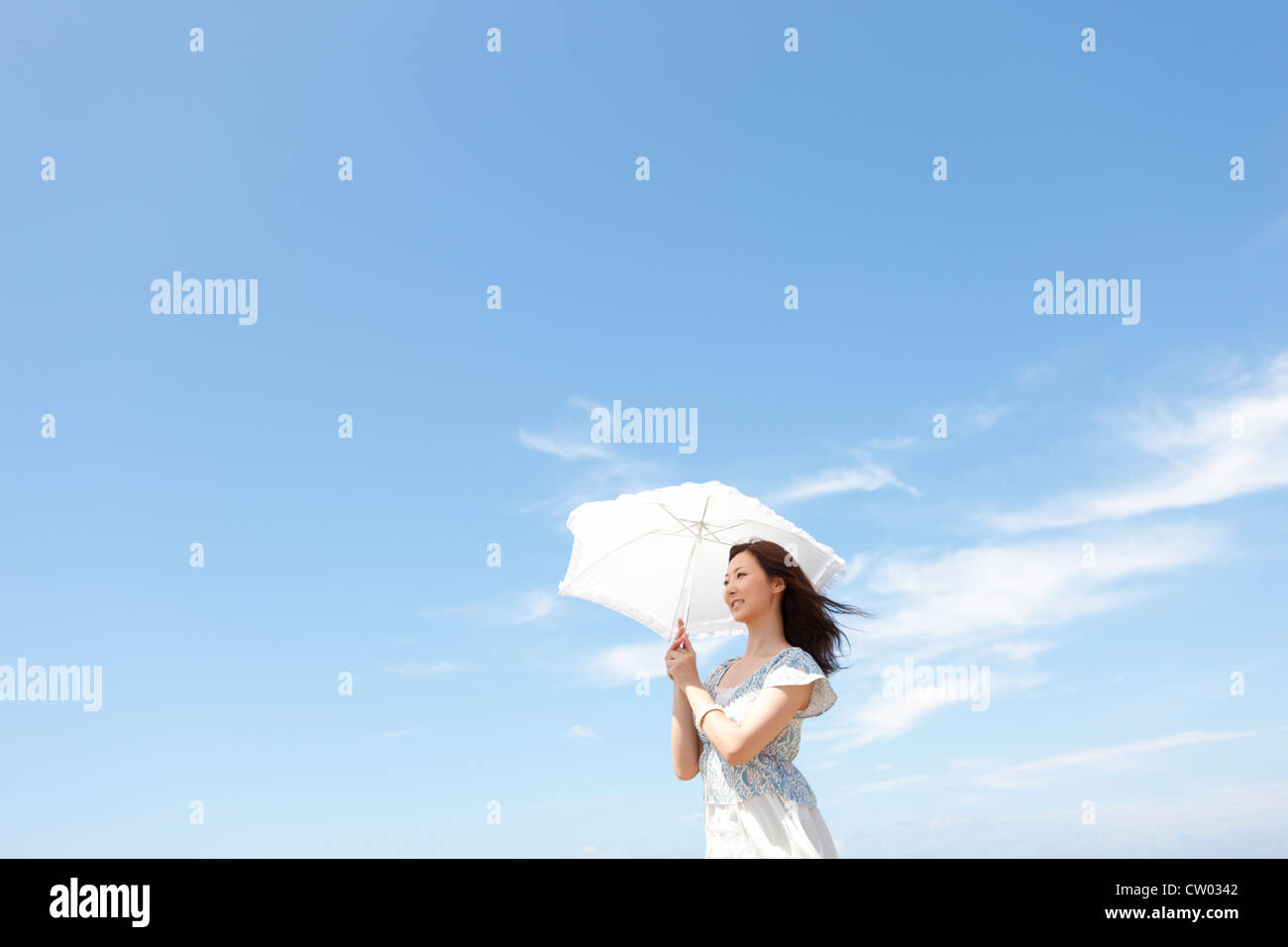 Woman with parasol Stock Photo