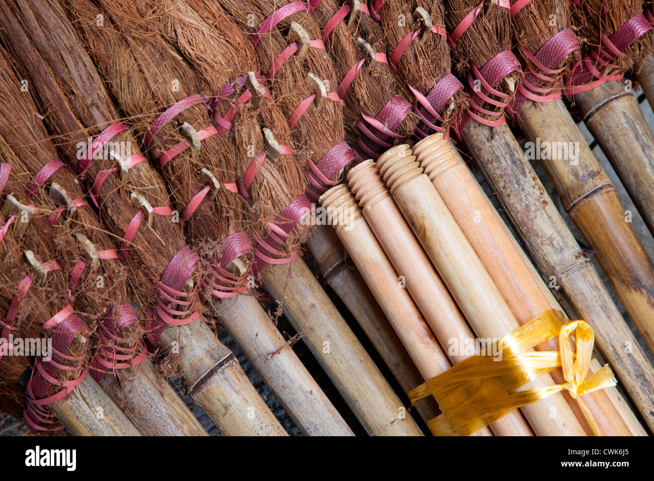 Asia, China, Hong Kong. A display of handmade straw dust brooms for sale. Stock Photo