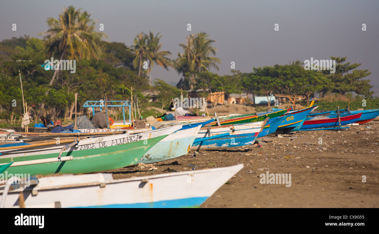 Colourful traditional fishing boats on a beach, Dili, East Timor Stock Photo