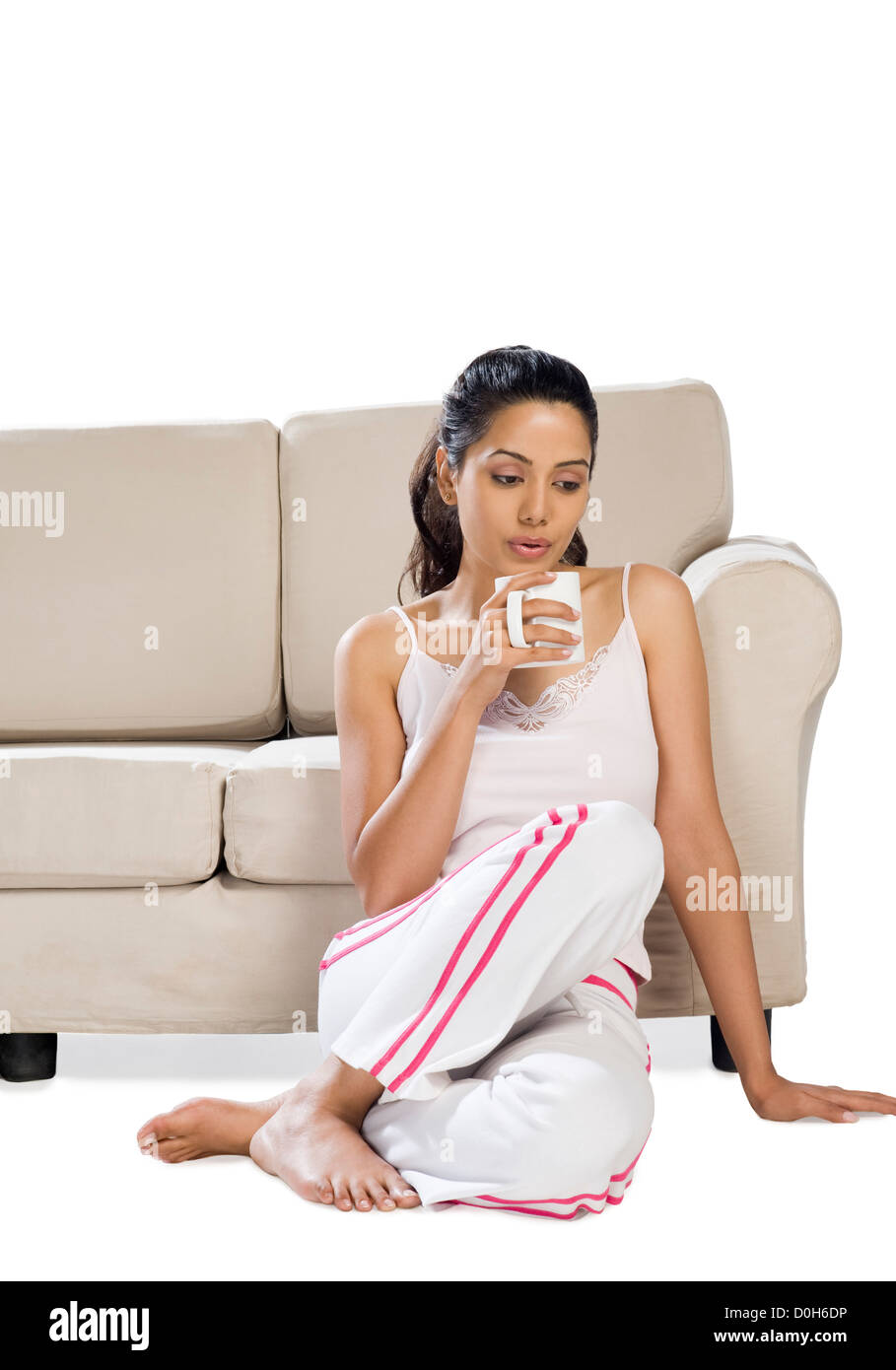 Young woman holding a coffee mug Stock Photo