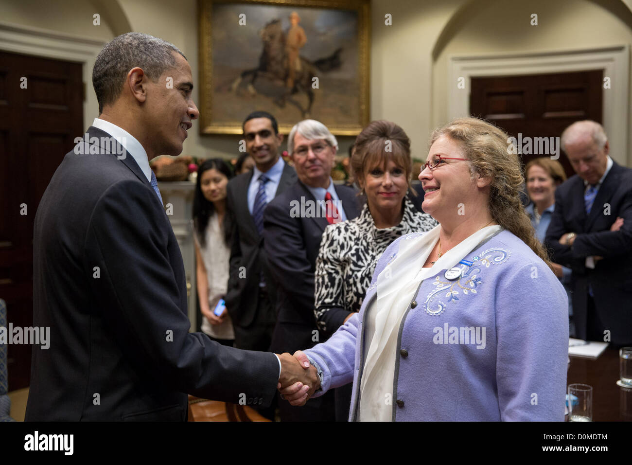 US President Barack Obama talks with small business owners to discuss the debt limit and deficit reduction and the upcoming fiscal cliff in the Roosevelt Room of the White House November 27, 2012 in Washington, DC. Stock Photo