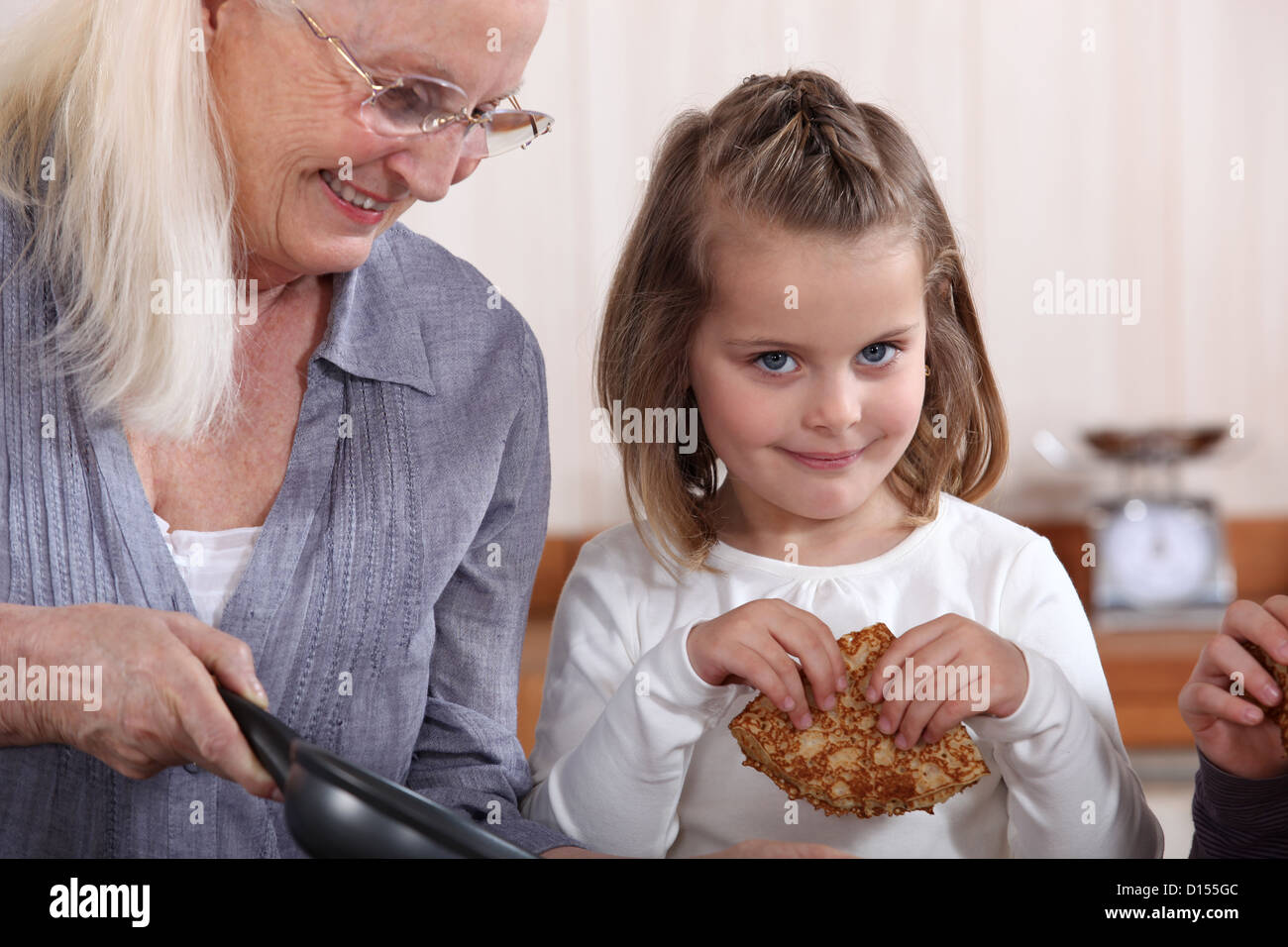 Child eating pancakes Stock Photo