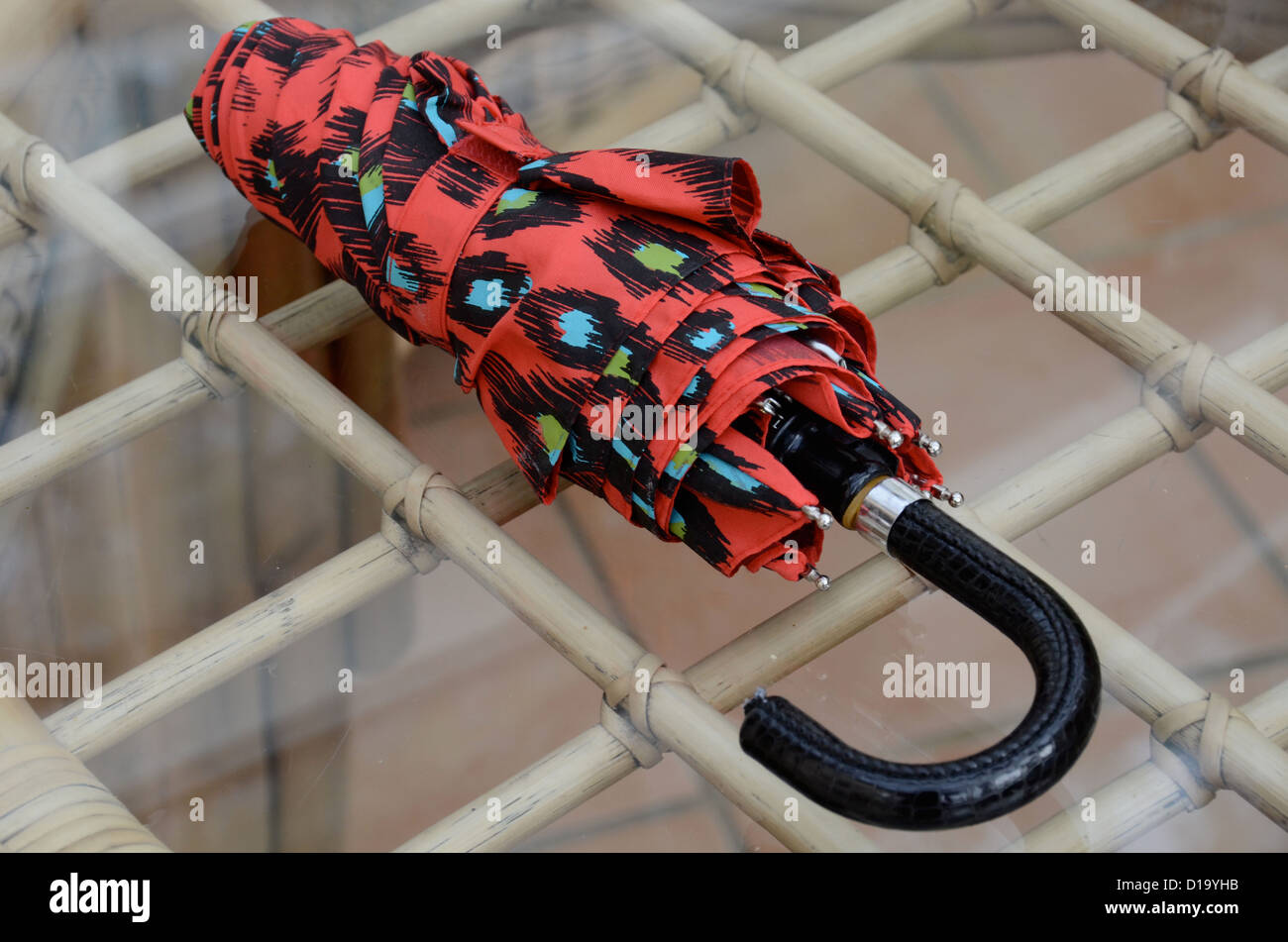 Compact umbrella on table Stock Photo