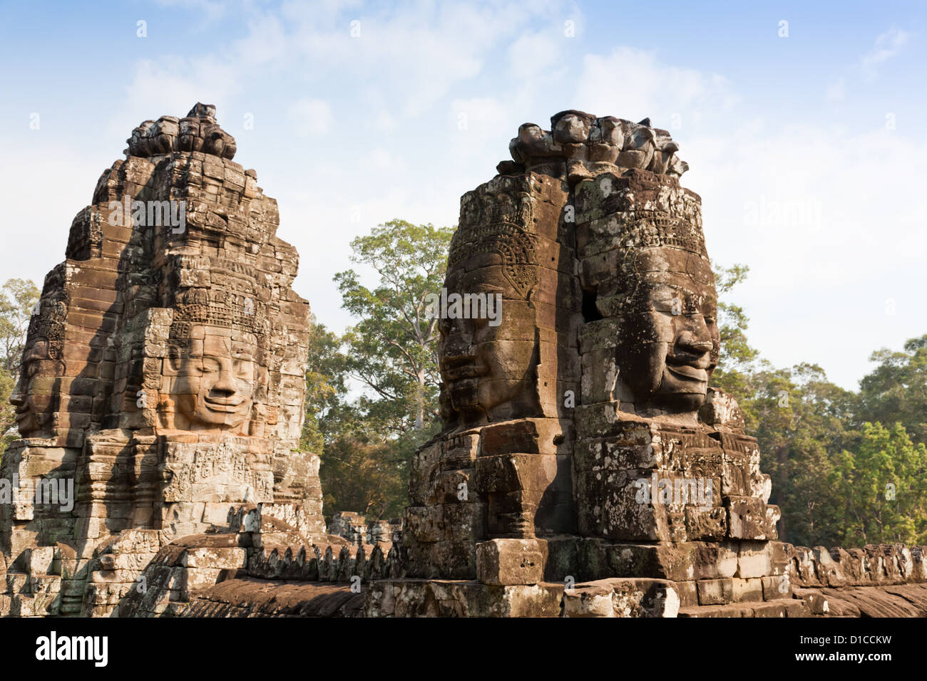 Smiling faces at Bayon Temple, Angkor, Cambodia. Bayon was built in the 13th century as the state temple of king Jayavarman VII. Stock Photo