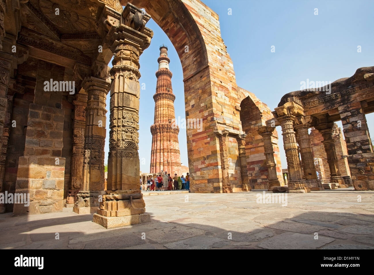 Group of tourists at Qutub Minar, Delhi, India Stock Photo