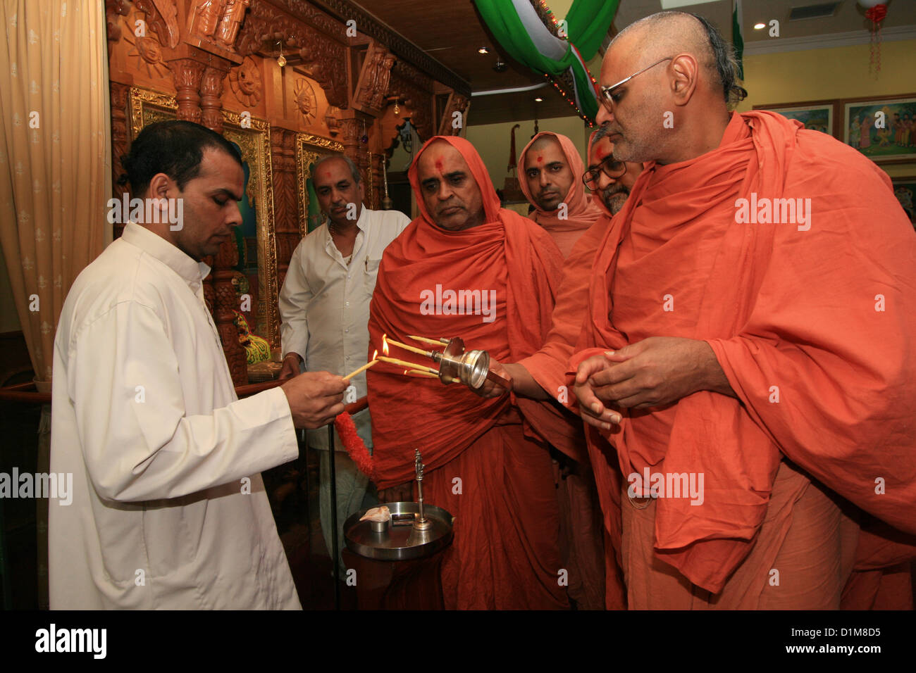 Hindu priests during celebration of Krishna Janmashtami in Shri Kutch Satsang Swaminarayan Mandir, London, UK Stock Photo