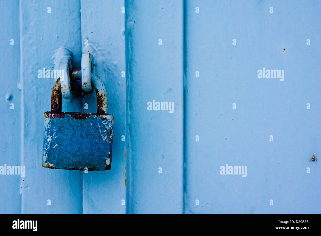 old rusty metal blue padlock Stock Photo