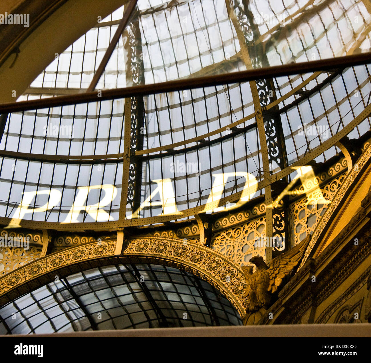 Prada luxury designer brand name identity mirrored reflection in ornate Galleria Vittorio Emanuele II Milan Italy Europe Stock Photo