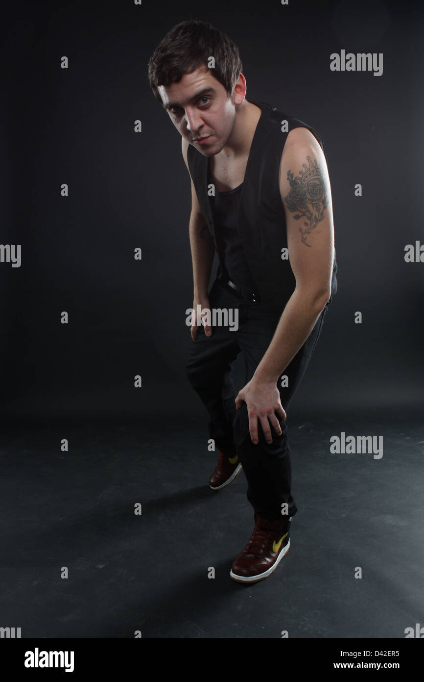 Man leaning forward towards the camera. Stock Photo