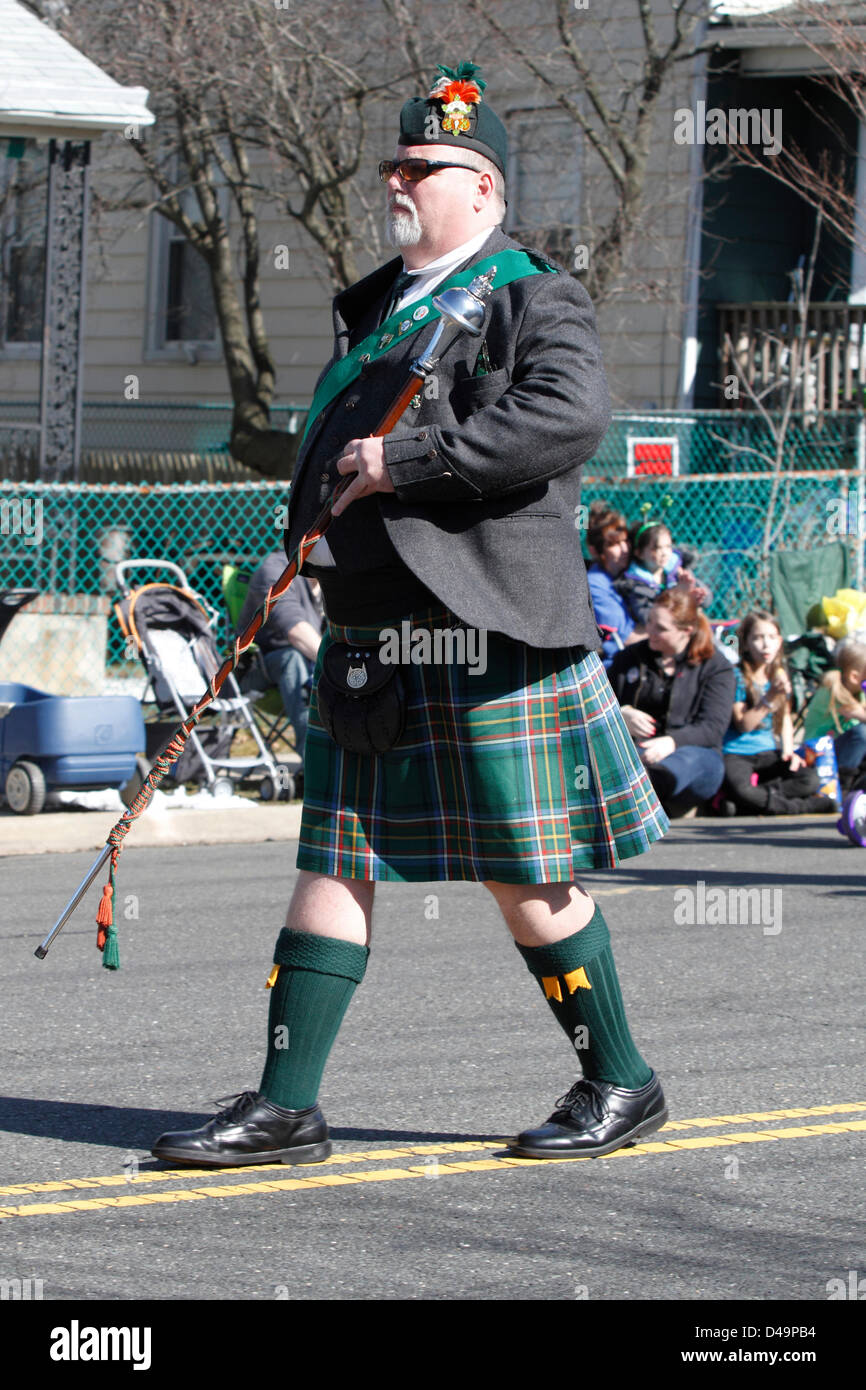 South Amboy, NJ, USA. 9th March, 2013. Band leader marches with baton in St. Patrick's Day parade in South Amboy, NJ USA Stock Photo