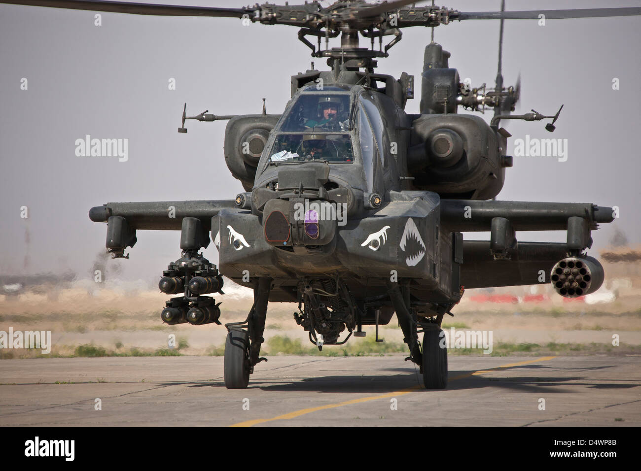 An AH-64 Apache helicopter returns from a mission over Northern Iraq during Operation Iraqi Freedom. Stock Photo