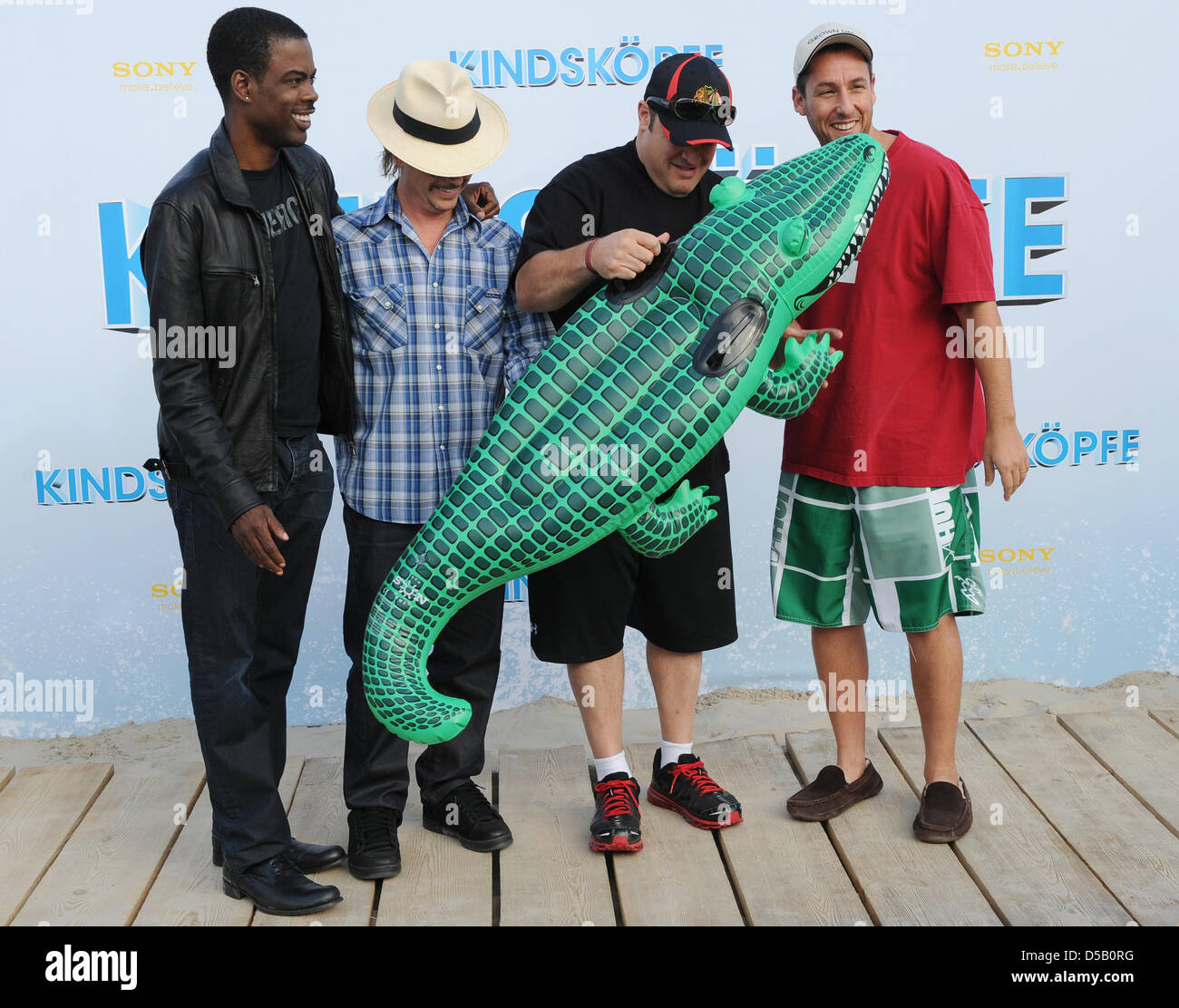 Cast members (L-R) US actors Chris Rock, David Spade, Kevin James and Adam Sandler arrive for the premiere of his film 'Grown Ups' in Berlin, Germany, 30 July 2010. The film is in German cinemans from 05 August on. Photo: JENS KALAENE Stock Photo