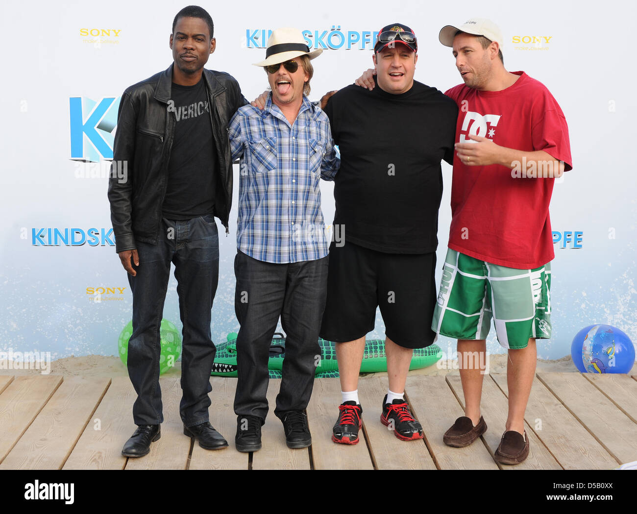 Cast members (L-R) US actors Chris Rock, DAvid Spade, Kevin James and Adam Sandler arrive for the premiere of his film 'Grown Ups' at the 'O2 World Arena' in Berlin, Germany, 30 July 2010. The film is in German cinemans from 05 August on. Photo: Jens Kalaene Stock Photo