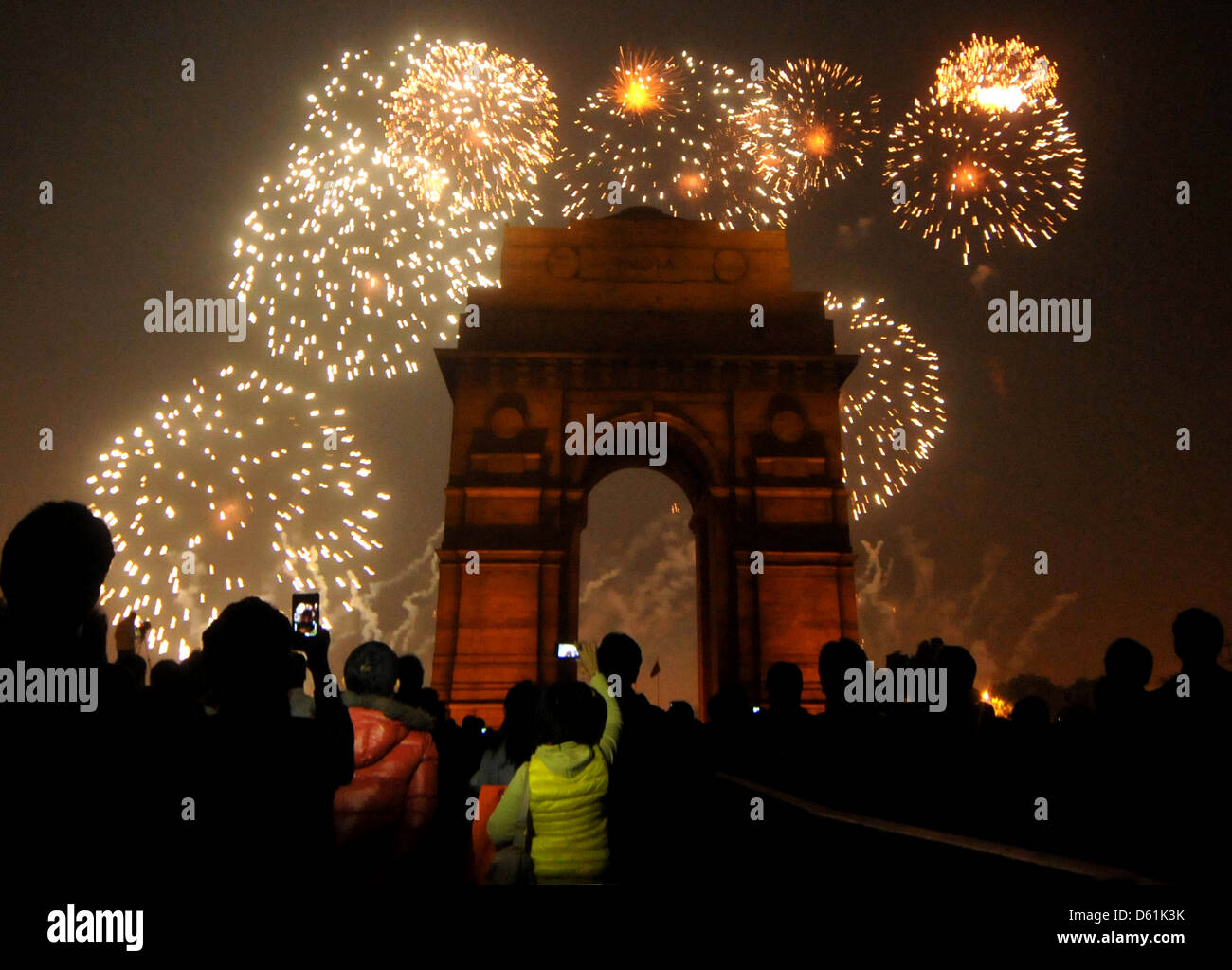 India Gate war memorial is silhouetted as fireworks light up the sky above, in New Delhi, India, Stock Photo