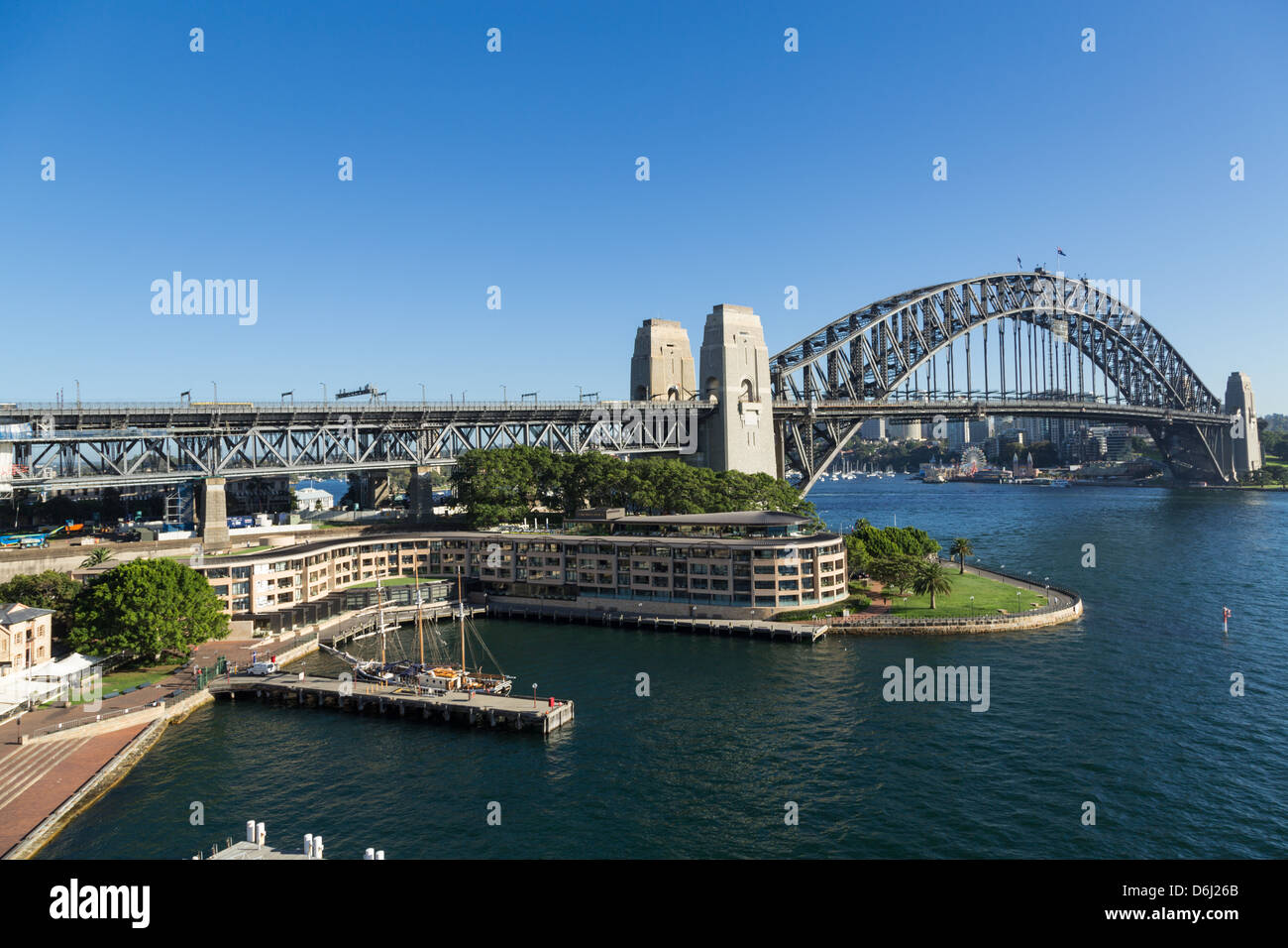 The Rocks and Sydney Harbour Bridge on a sunny morning. Stock Photo