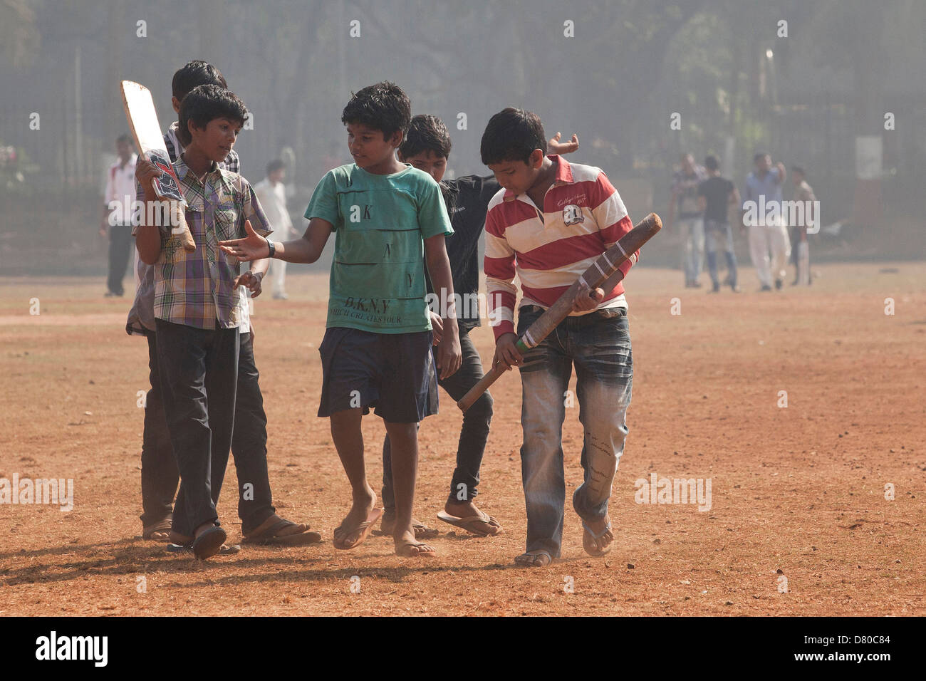 Boys playing cricket at the Oval Maidan in Mumbai, India Stock Photo